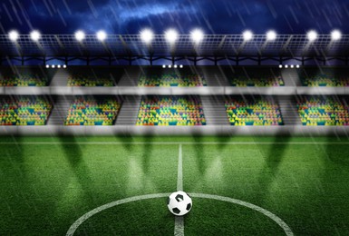 Image of Soccer ball on football field at stadium