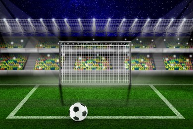Image of Soccer ball on football field at stadium