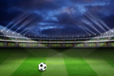 Image of Soccer ball on football field at stadium