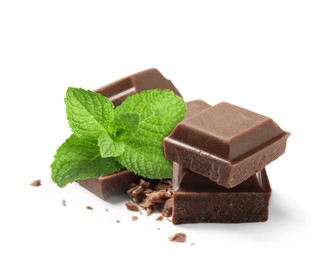 Image of Milk chocolate pieces and mint leaves on white background