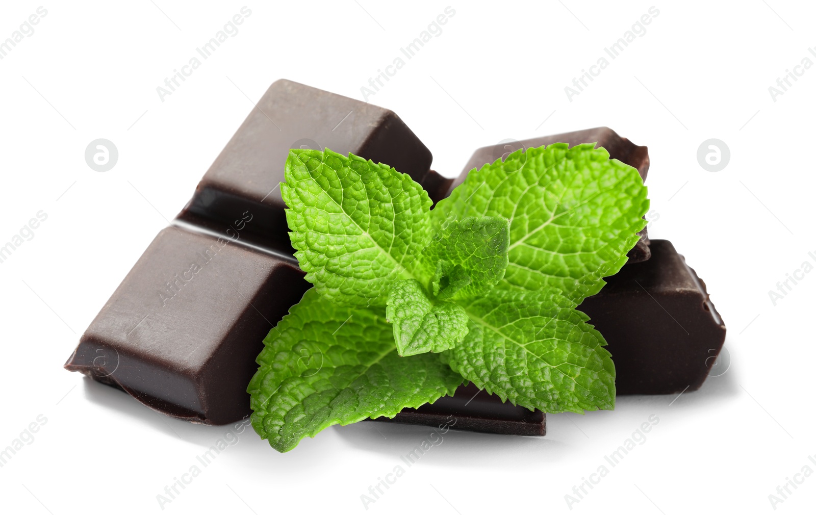 Dark chocolate pieces and mint leaves on white background Image of Dark chocolate pieces and mint leaves on white background
