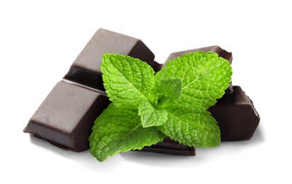 Image of Dark chocolate pieces and mint leaves on white background