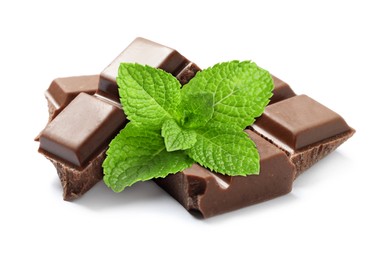 Image of Milk chocolate pieces and mint leaves on white background