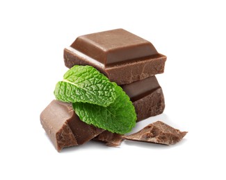 Image of Milk chocolate pieces and mint leaves on white background