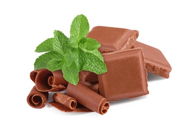 Image of Milk chocolate pieces, curls and mint leaves on white background