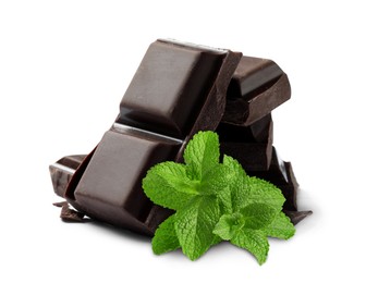 Image of Dark chocolate pieces and mint leaves on white background