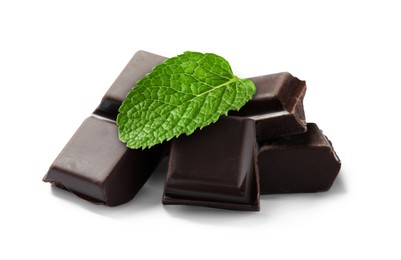 Image of Dark chocolate pieces and mint leaf on white background