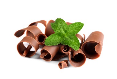 Image of Milk chocolate curls and mint leaves on white background