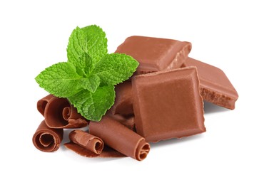 Image of Milk chocolate pieces, curls and mint leaves on white background