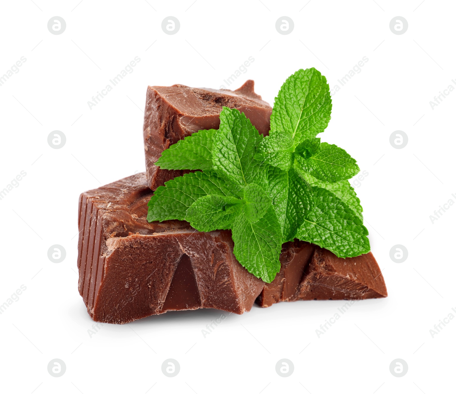 Milk chocolate chunks and mint leaves on white background Image of Milk chocolate chunks and mint leaves on white background