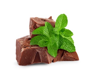 Image of Milk chocolate chunks and mint leaves on white background