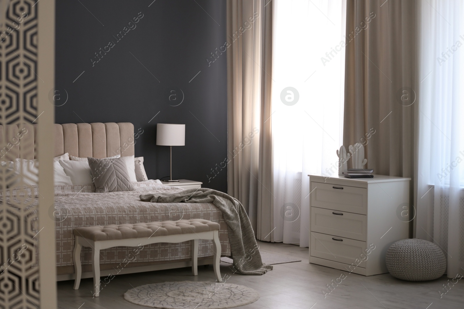 Beautiful curtains on window in stylish bedroom interior Photo of Beautiful curtains on window in stylish bedroom interior