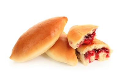 Photo of Tasty baked patties with strawberry filling isolated on white