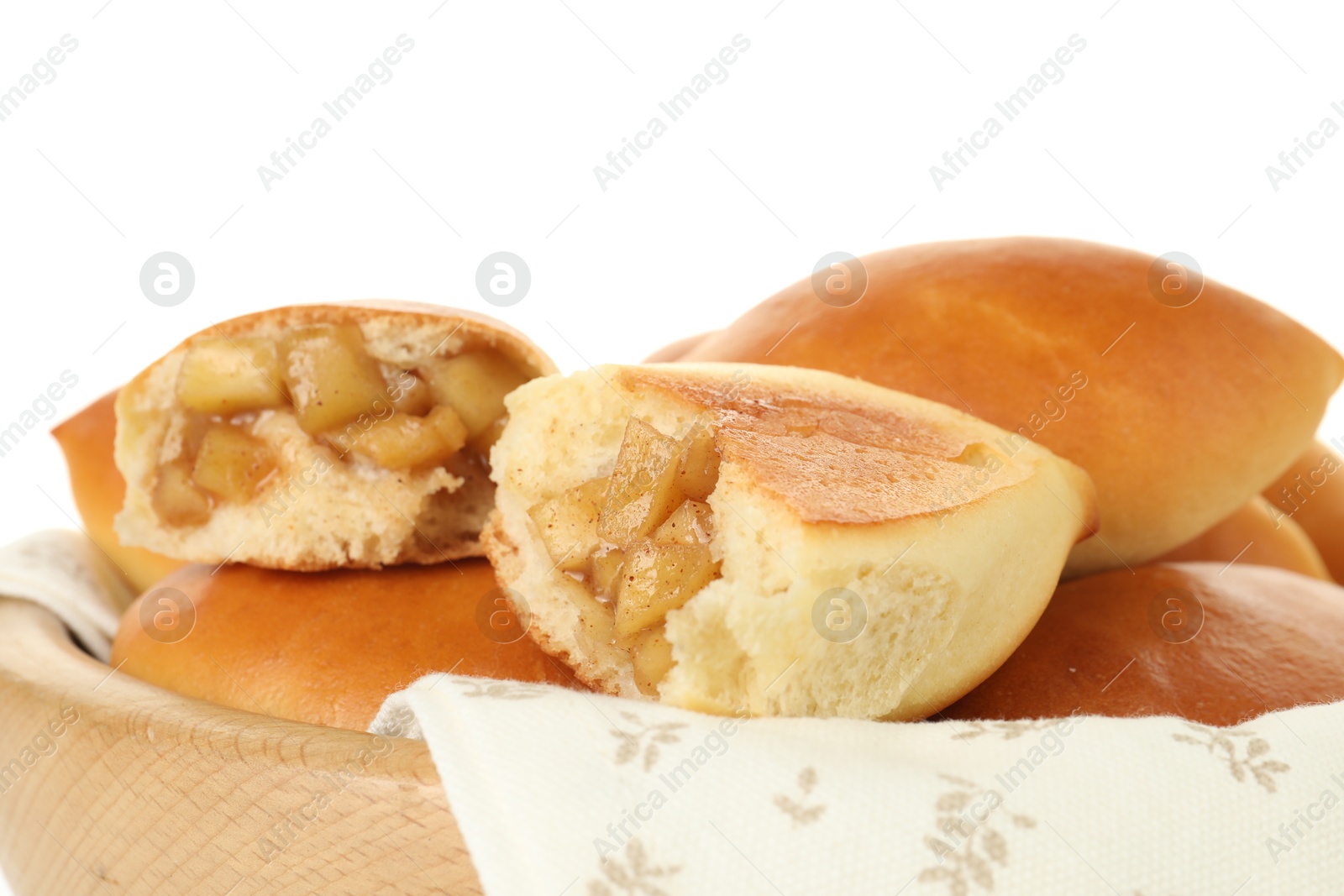 Tasty baked patties with apples in wooden bowl on white background, closeup Photo of Tasty baked patties with apples in wooden bowl on white background, closeup