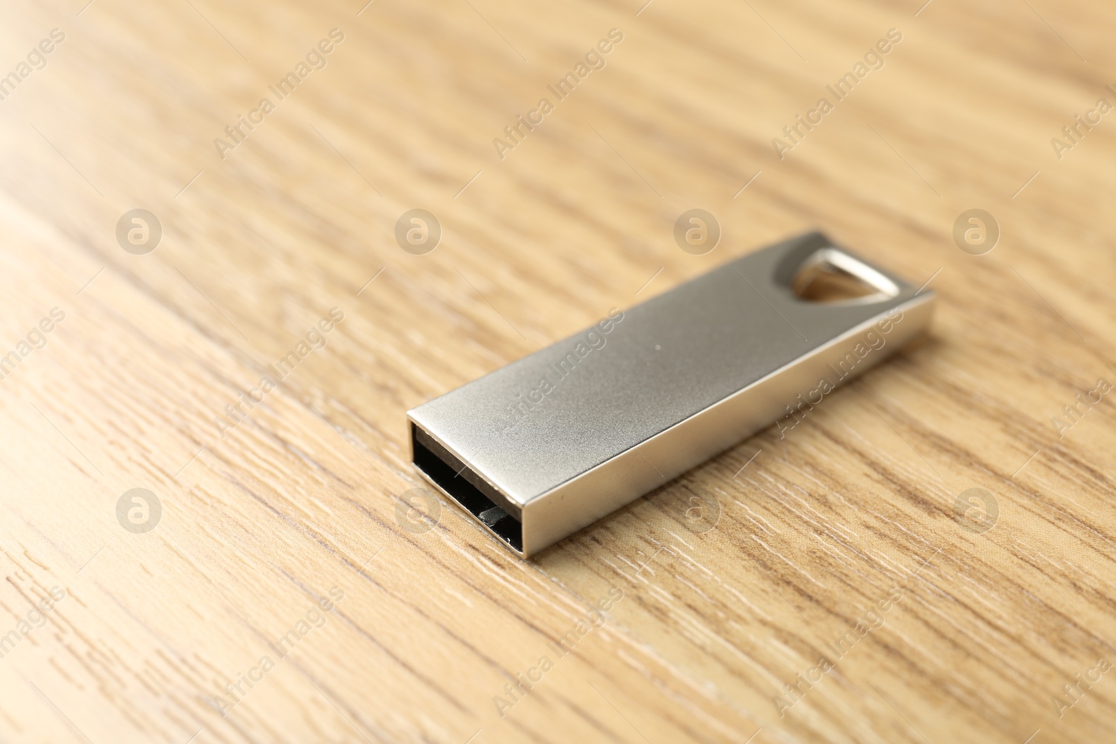 One flash drive on wooden background, closeup. Space for text Photo of One flash drive on wooden background, closeup. Space for text