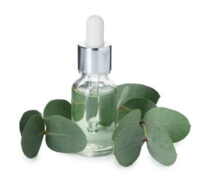 Photo of Bottle of essential oil and eucalyptus leaves isolated on white