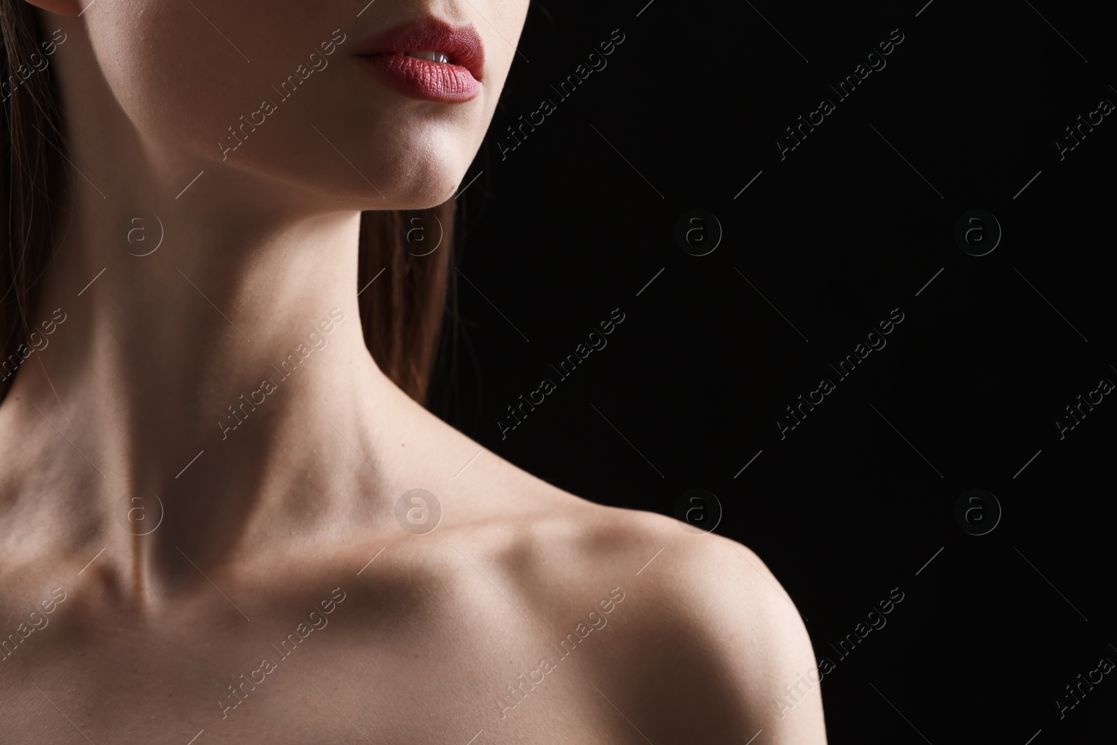 Woman with perfect skin on black background, closeup. Space for text Photo of Woman with perfect skin on black background, closeup. Space for text
