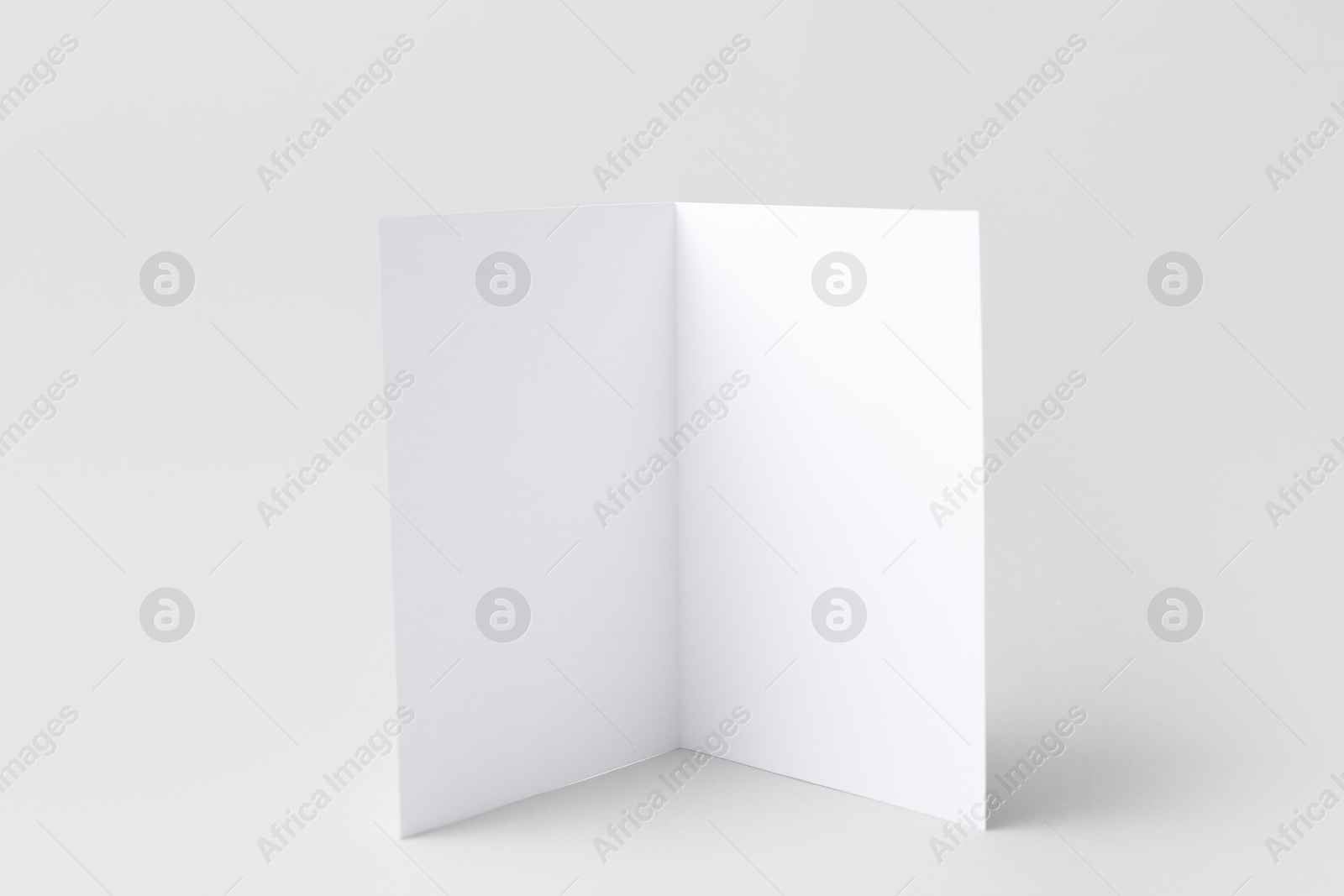 Photo of One blank greeting card on light background