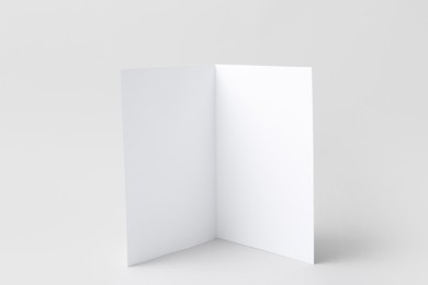 Photo of One blank greeting card on light background