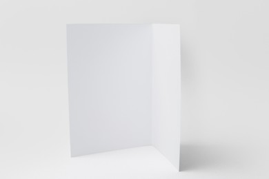 Photo of One blank greeting card on light background