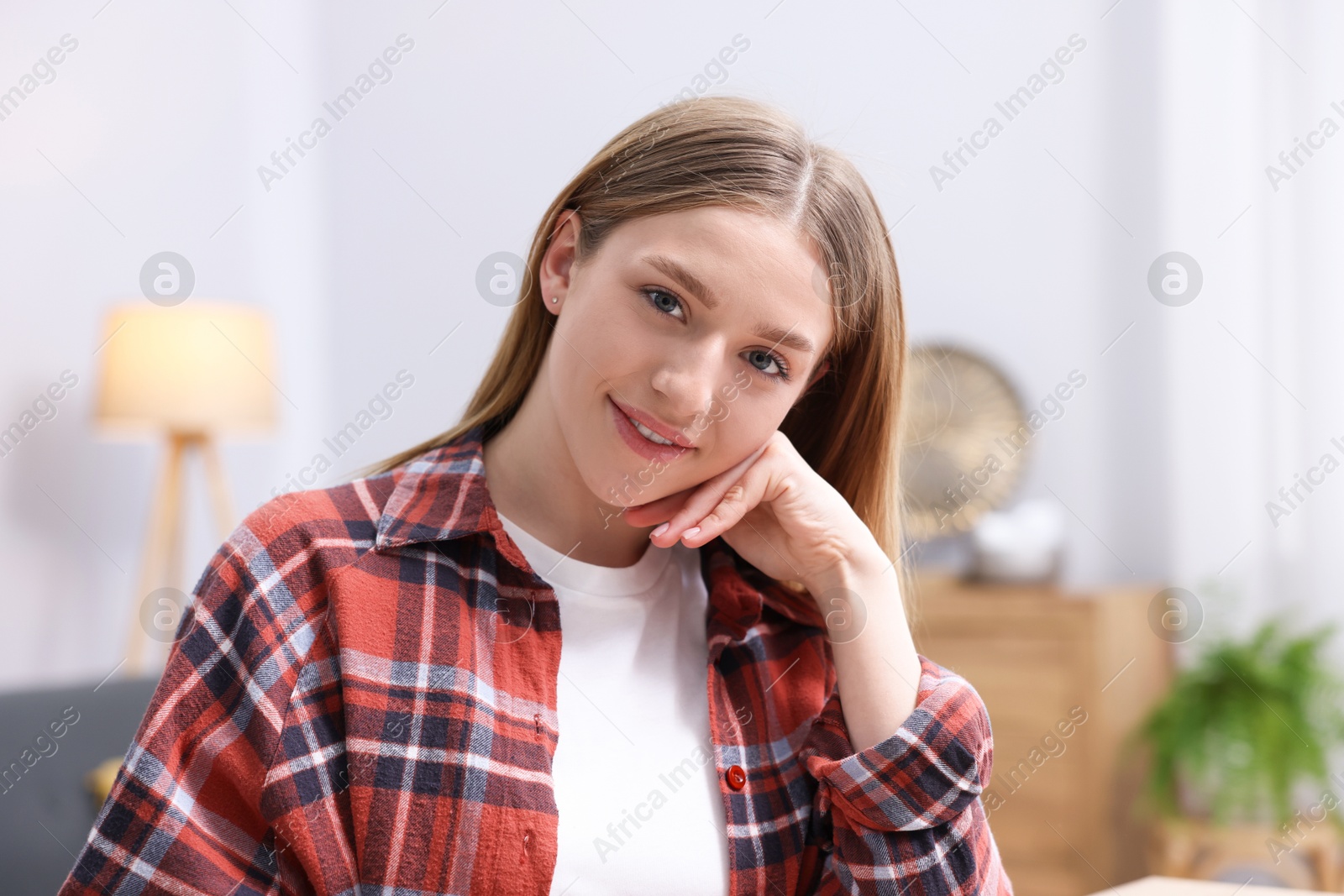 Portrait of smiling teenage girl at home Photo of Portrait of smiling teenage girl at home