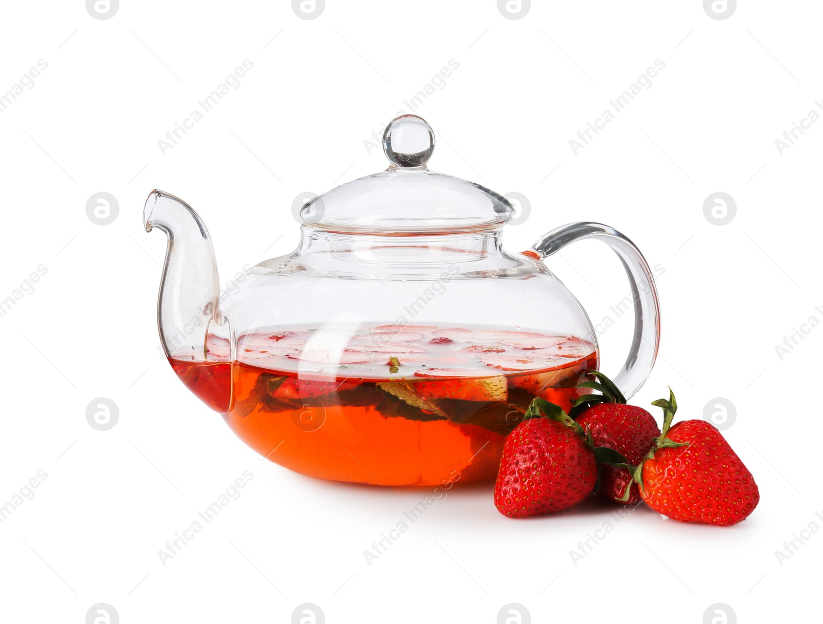 Glass teapot with aromatic fruit tea, strawberries and mint isolated on white Photo of Glass teapot with aromatic fruit tea, strawberries and mint isolated on white