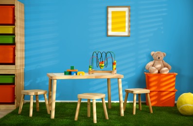 Image of Cozy playroom with toys and furniture. Stylish children's room interior