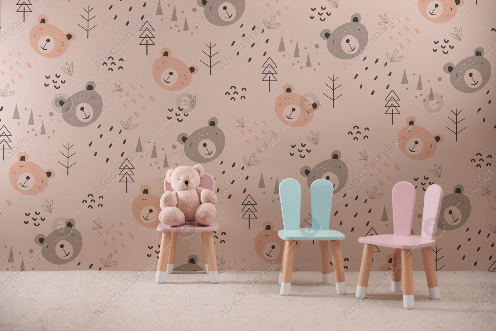 Cozy playroom with toy, small chairs and cute wallpaper. Children's room interior Image of Cozy playroom with toy, small chairs and cute wallpaper. Children's room interior