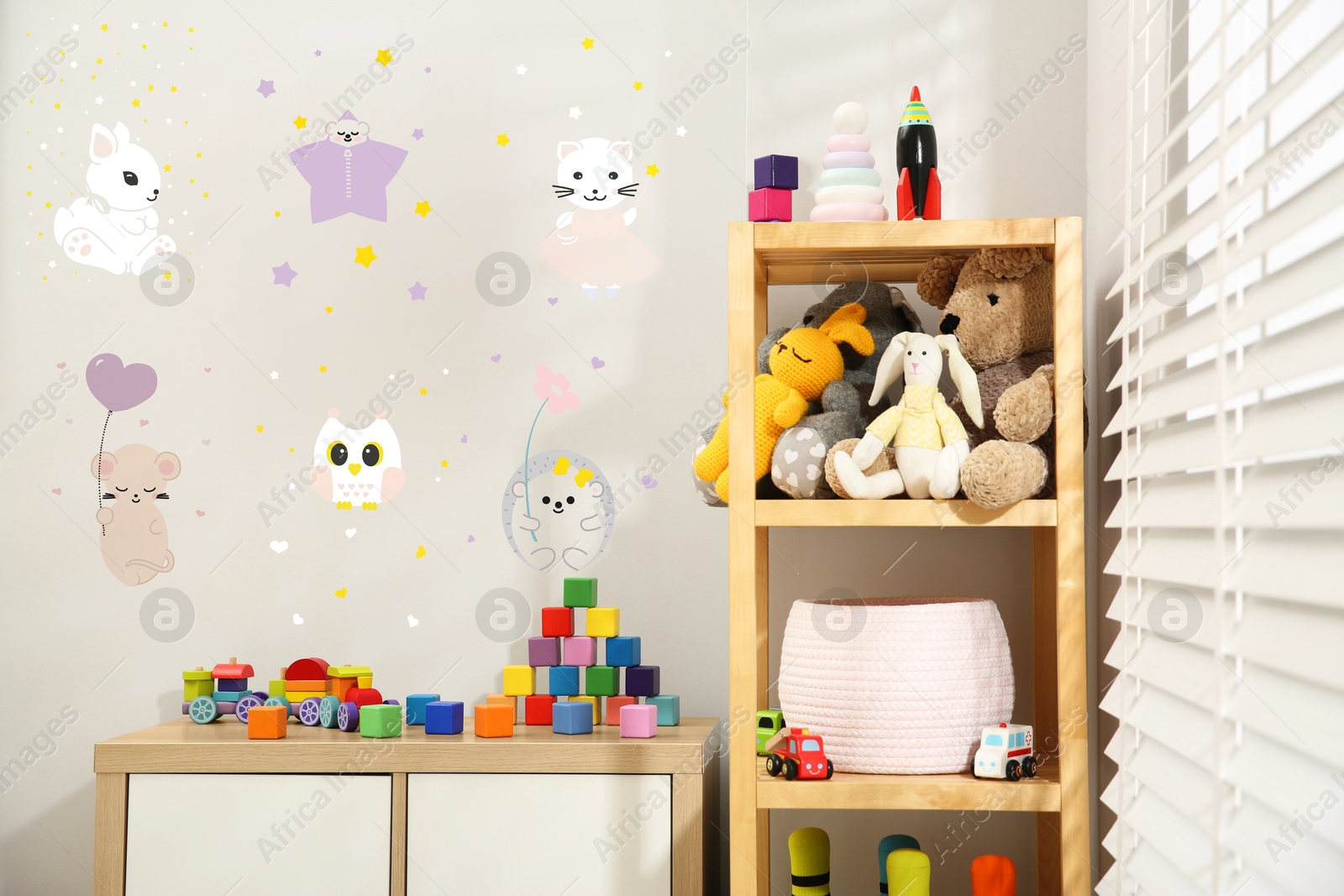 Cozy playroom with toys, furniture and cute wallpaper. Stylish children's room interior Image of Cozy playroom with toys, furniture and cute wallpaper. Stylish children's room interior