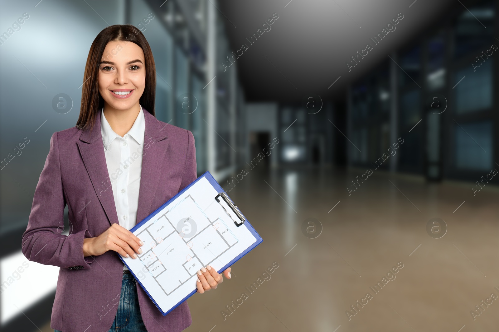 Real estate agent holding clipboard with house plan indoors, space for text Image of Real estate agent holding clipboard with house plan indoors, space for text