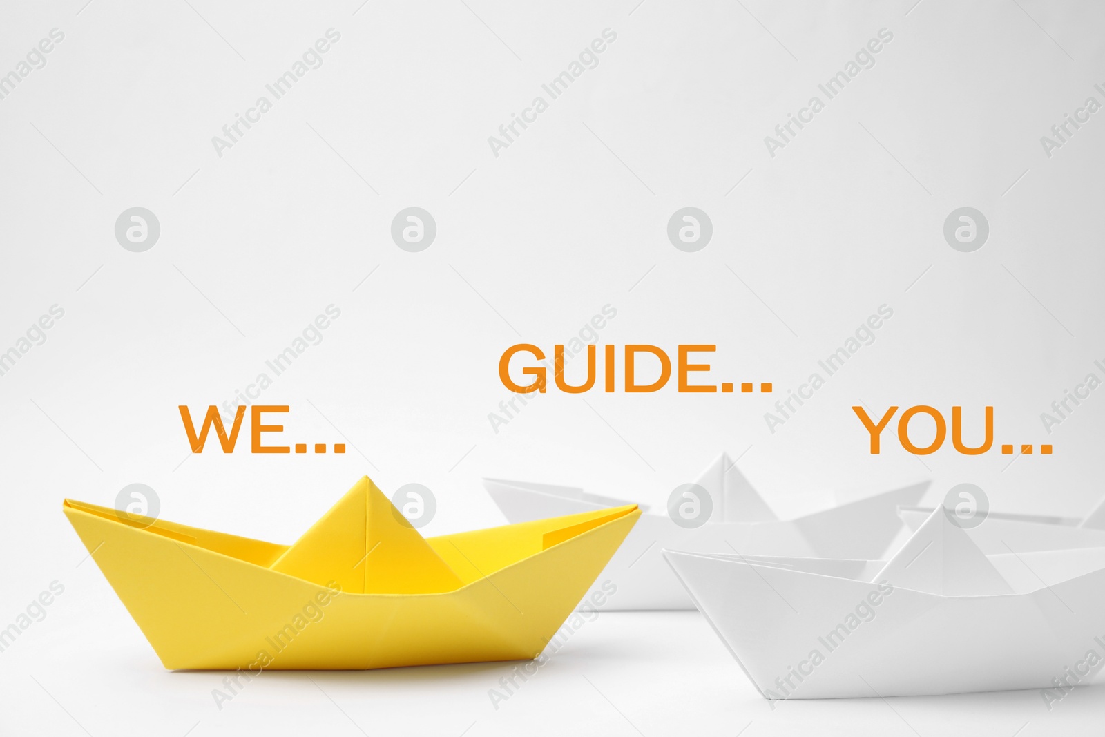 We guide you. Yellow paper boat leading white ones on white background Image of We guide you. Yellow paper boat leading white ones on white background