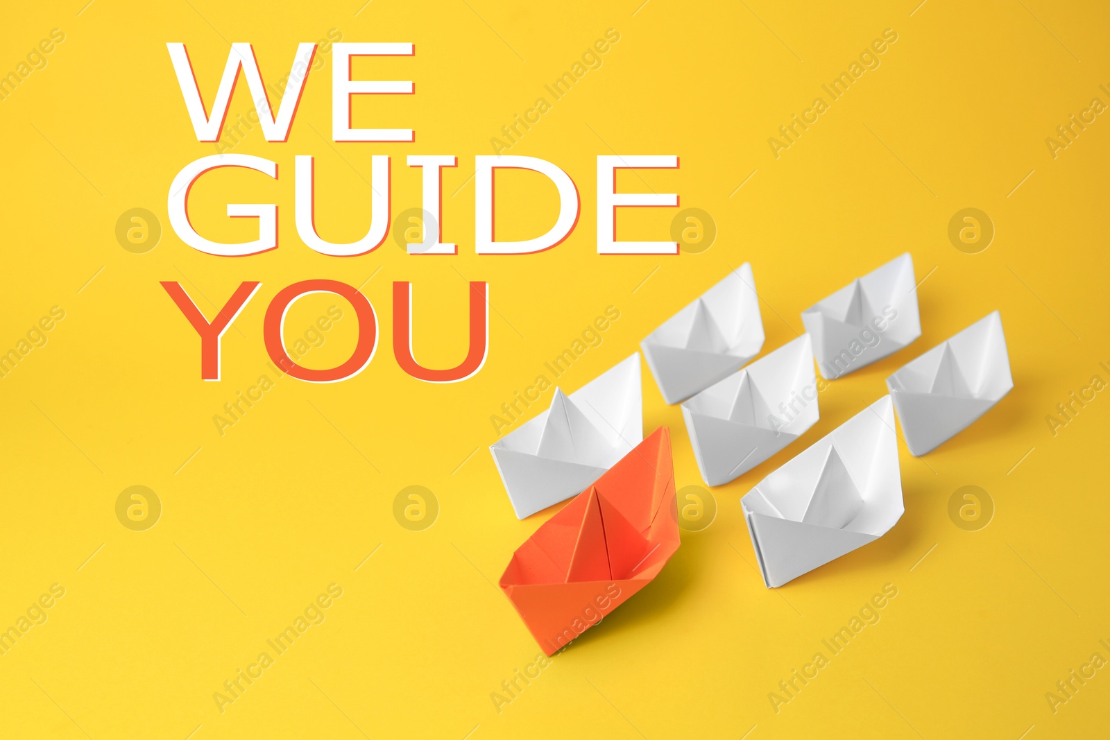 We guide you. Orange paper boat leading white ones on yellow background Image of We guide you. Orange paper boat leading white ones on yellow background