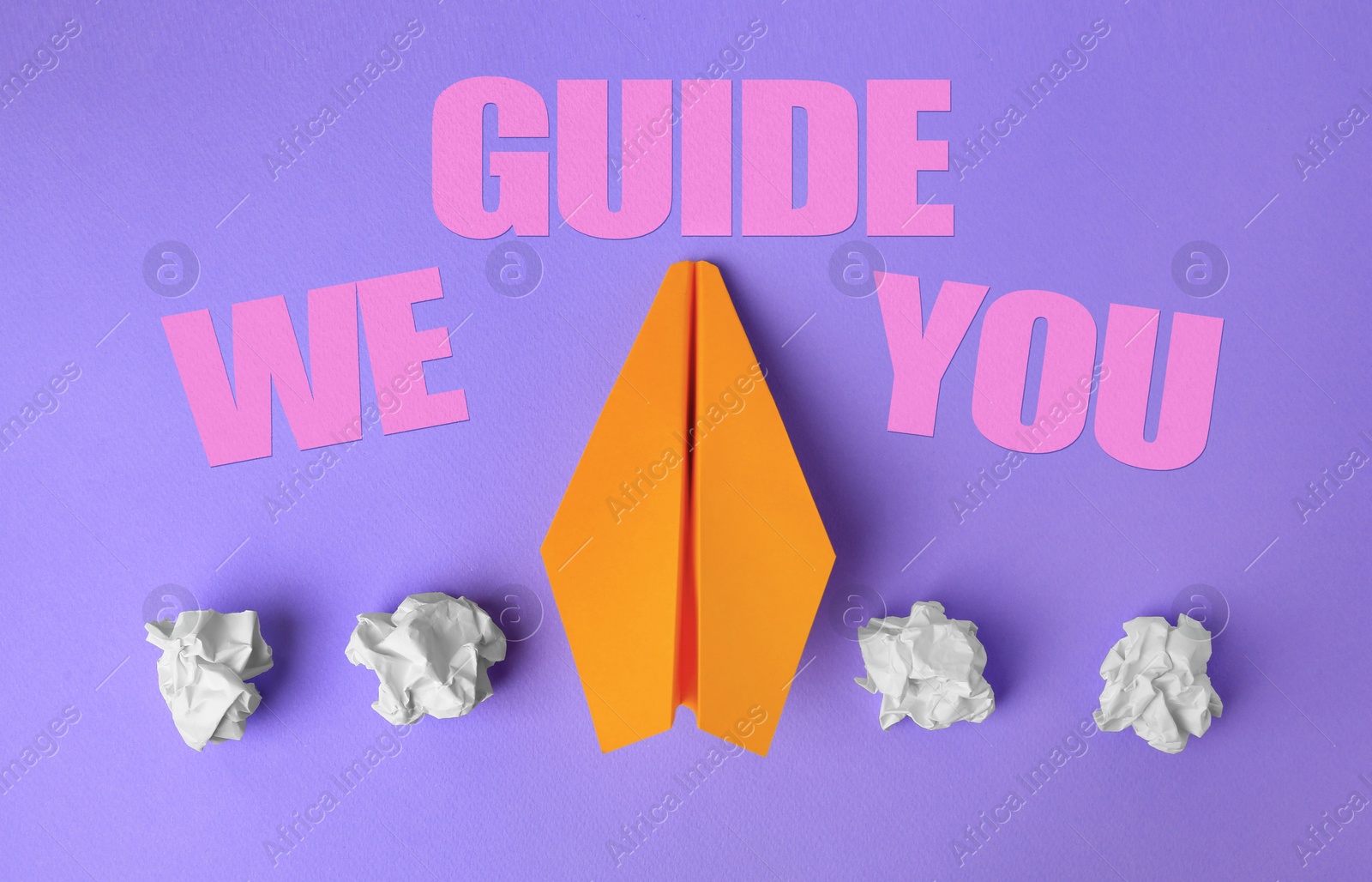 We guide you. Orange paper plane among crumpled balls on violet background, flat lay Image of We guide you. Orange paper plane among crumpled balls on violet background, flat lay