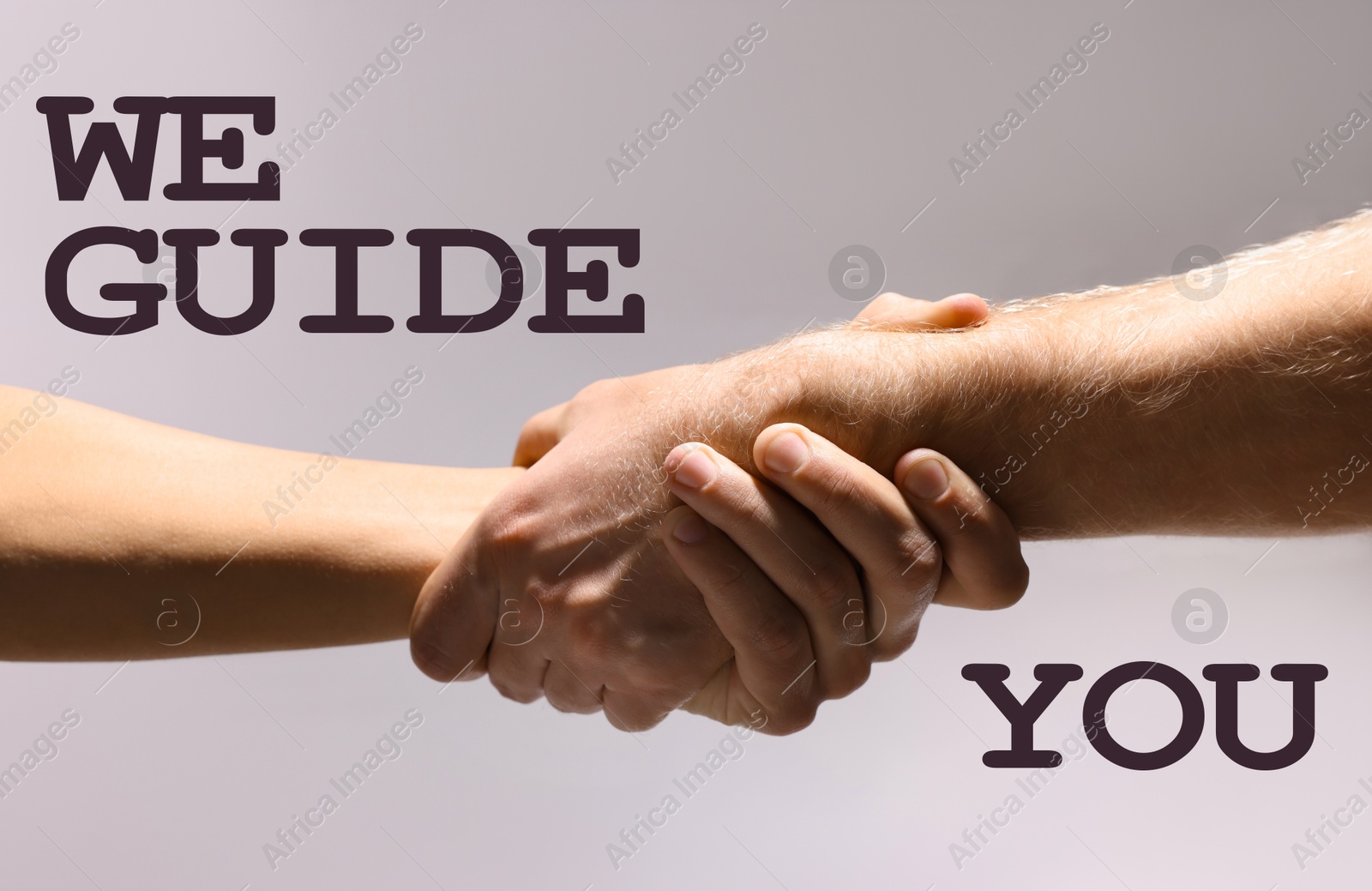 We guide you. People holding hands on grey background, closeup Image of We guide you. People holding hands on grey background, closeup