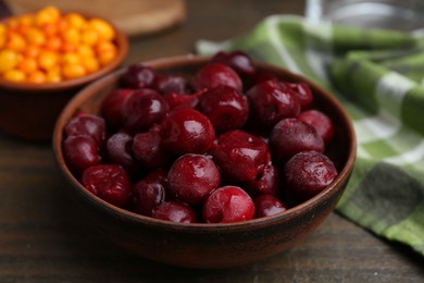 Photo of Tasty cherries and other fruits on wooden table, closeup