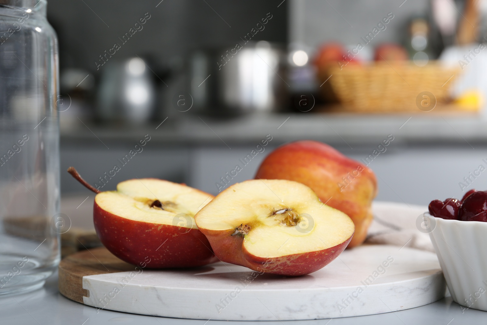 Tasty apples and cherries on light grey table, closeup Photo of Tasty apples and cherries on light grey table, closeup