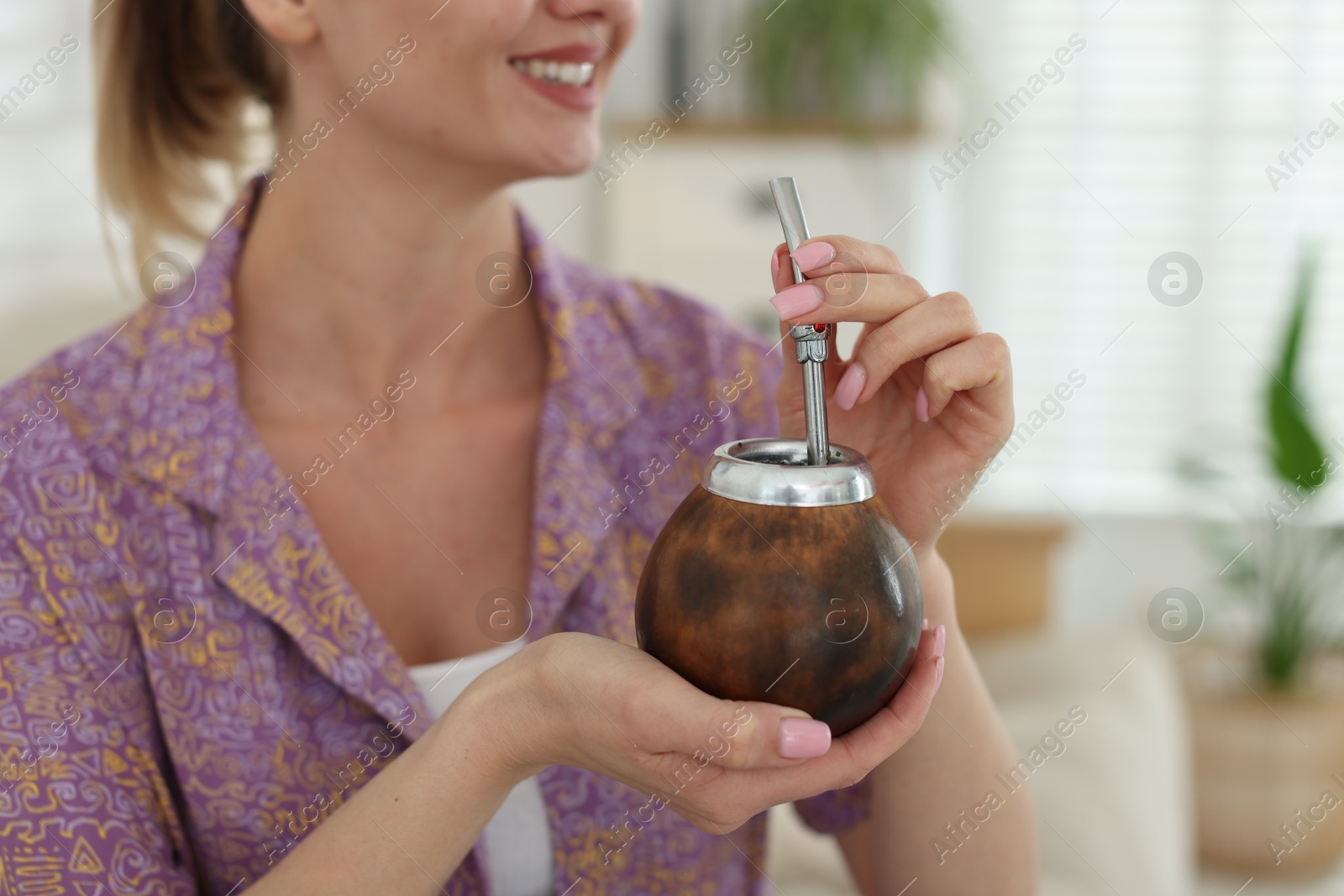 Woman with traditional yerba mate tea at home, closeup. Space for text Photo of Woman with traditional yerba mate tea at home, closeup. Space for text