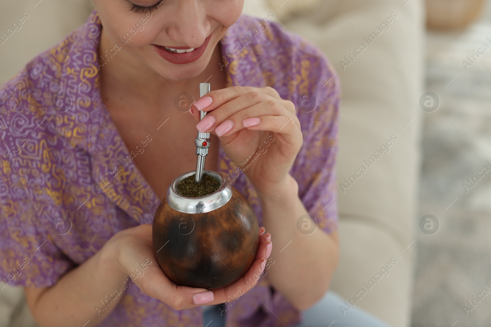Woman with traditional yerba mate tea at home, closeup. Space for text Photo of Woman with traditional yerba mate tea at home, closeup. Space for text