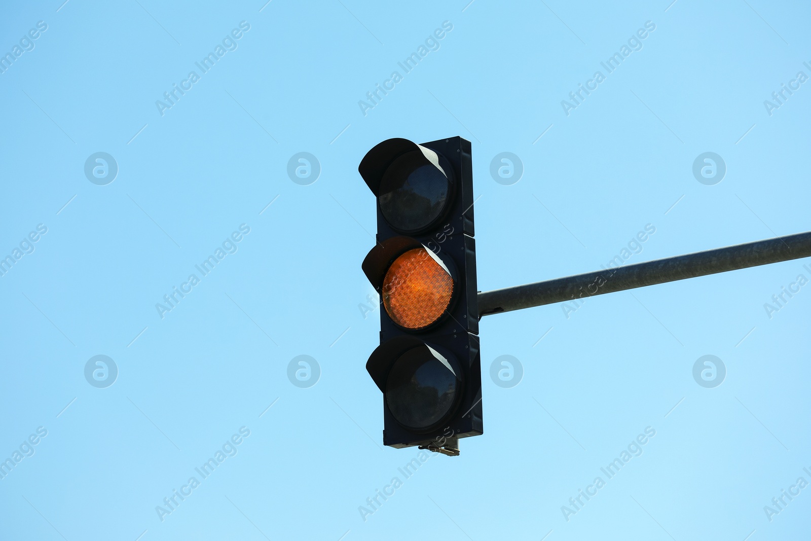 View of traffic light against blue sky Photo of View of traffic light against blue sky