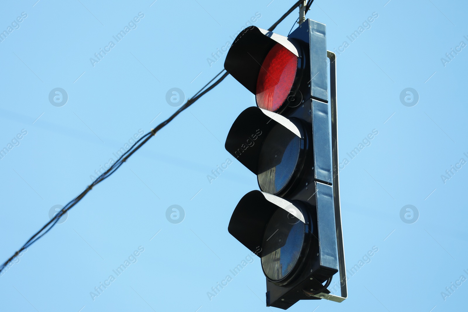 View of traffic light against blue sky Photo of View of traffic light against blue sky