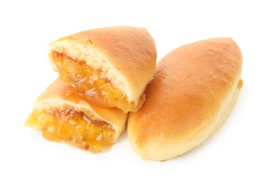 Photo of Tasty baked patties with orange jam isolated on white