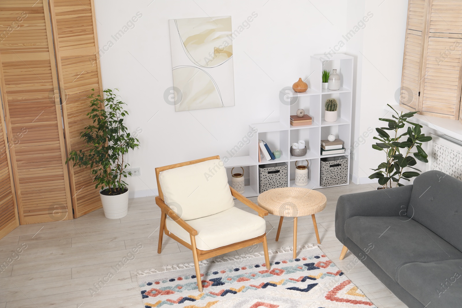 Comfortable sofa, armchair and side table in living room Photo of Comfortable sofa, armchair and side table in living room