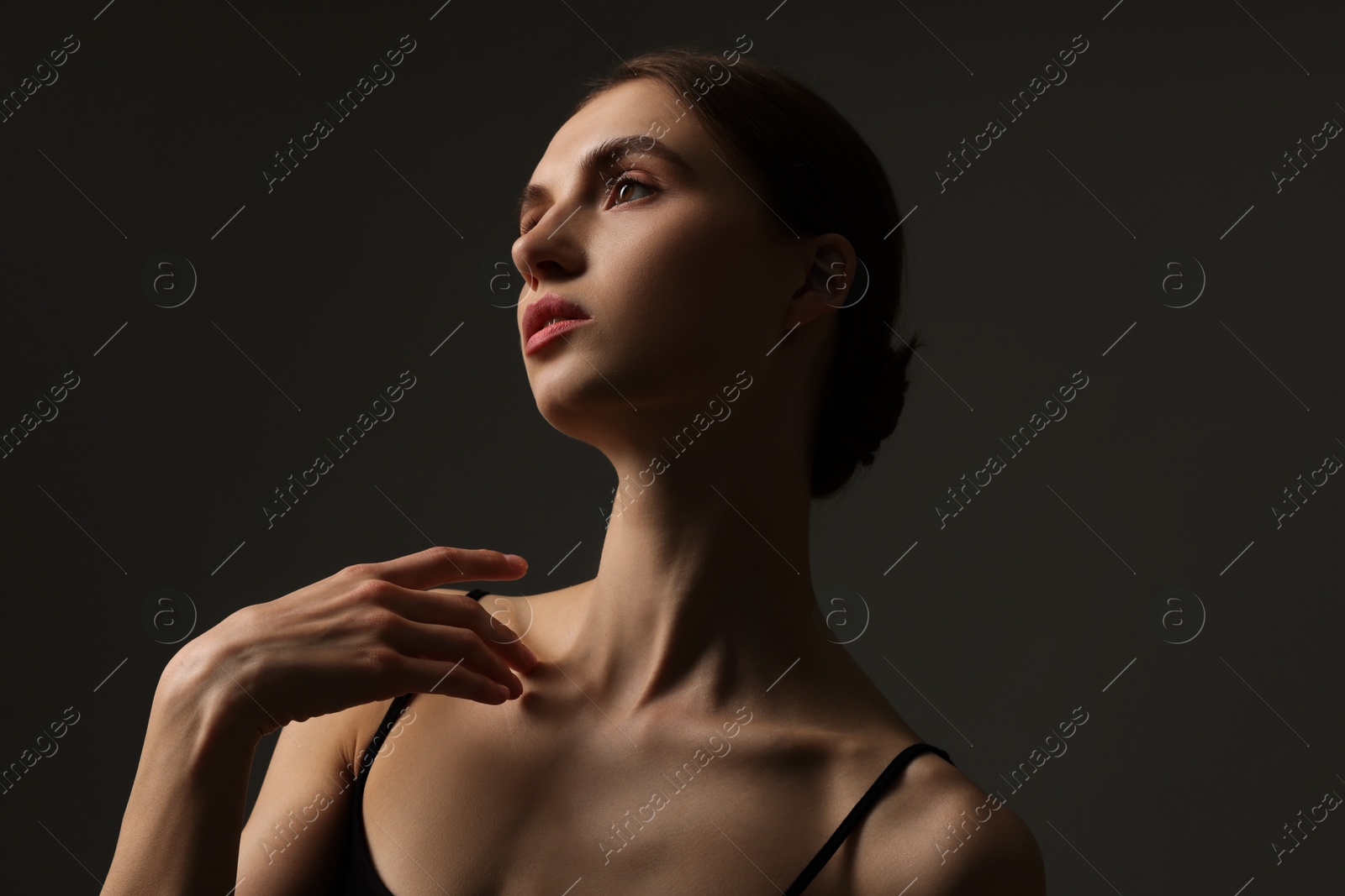 Beautiful woman with perfect skin on grey background Photo of Beautiful woman with perfect skin on grey background