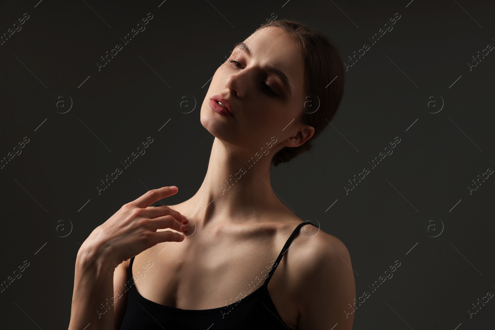 Beautiful woman with perfect skin on grey background Photo of Beautiful woman with perfect skin on grey background