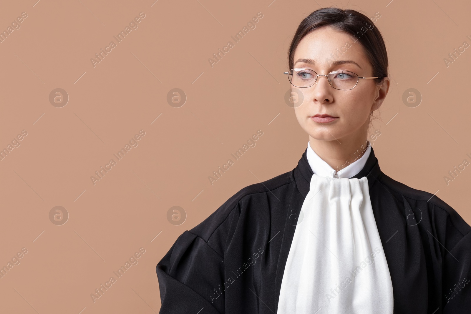 Judge on light brown background, space for text Photo of Judge on light brown background, space for text