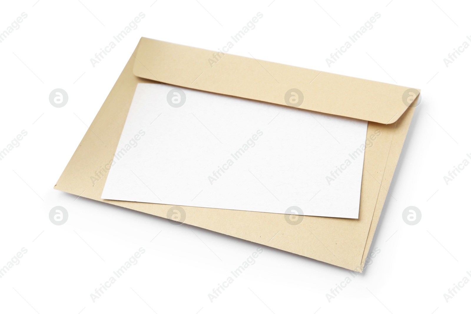 Photo of Blank greeting card and paper envelope on white background, above view