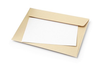 Photo of Blank greeting card and paper envelope on white background, above view