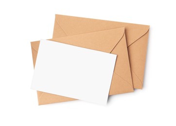 Photo of Blank greeting card and paper envelopes on white background, top view