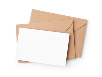Photo of Blank greeting card and paper envelopes on white background, top view