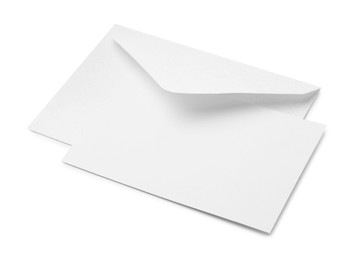 Photo of Blank greeting card and paper envelope on white background